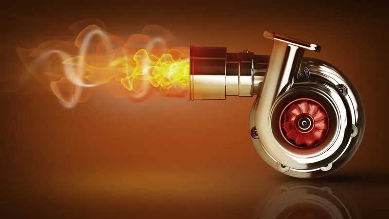 Render of a chrome turbocharger with exhaust gases glowing at its inlet