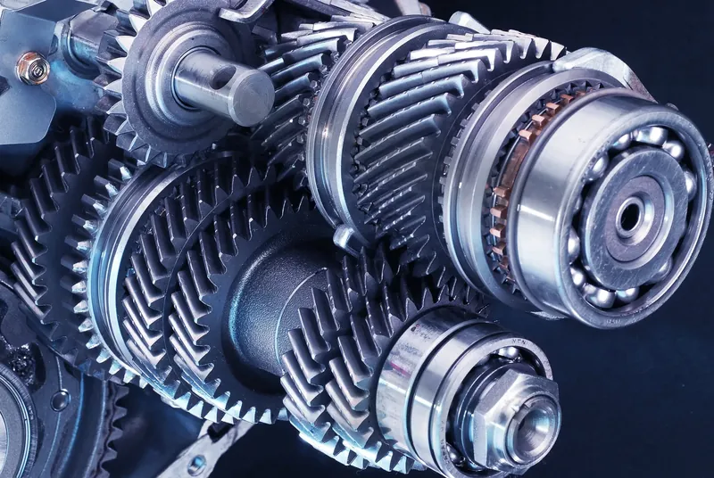 Close-up of the gears, shafts and bearings inside a car gearbox